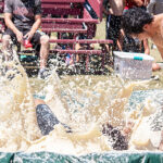 people wrestling in mashed potatoes